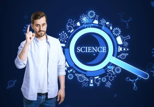 attractive-young-european-businessman-pointing-up-creative-glowing-magnifier-hologram-blue-background-science-research-medicine-concept_670147-63697