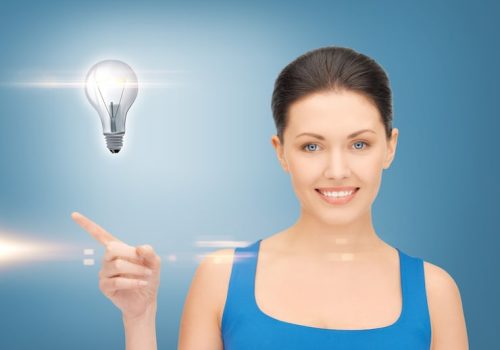 beautiful-woman-showing-light-bulb-her-hand_380164-30601